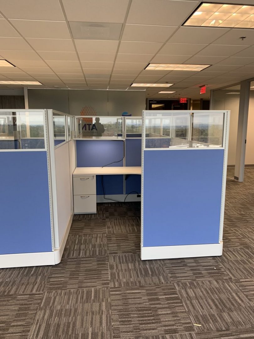 office cubicle with blue walls