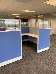 office cubicle with blue walls